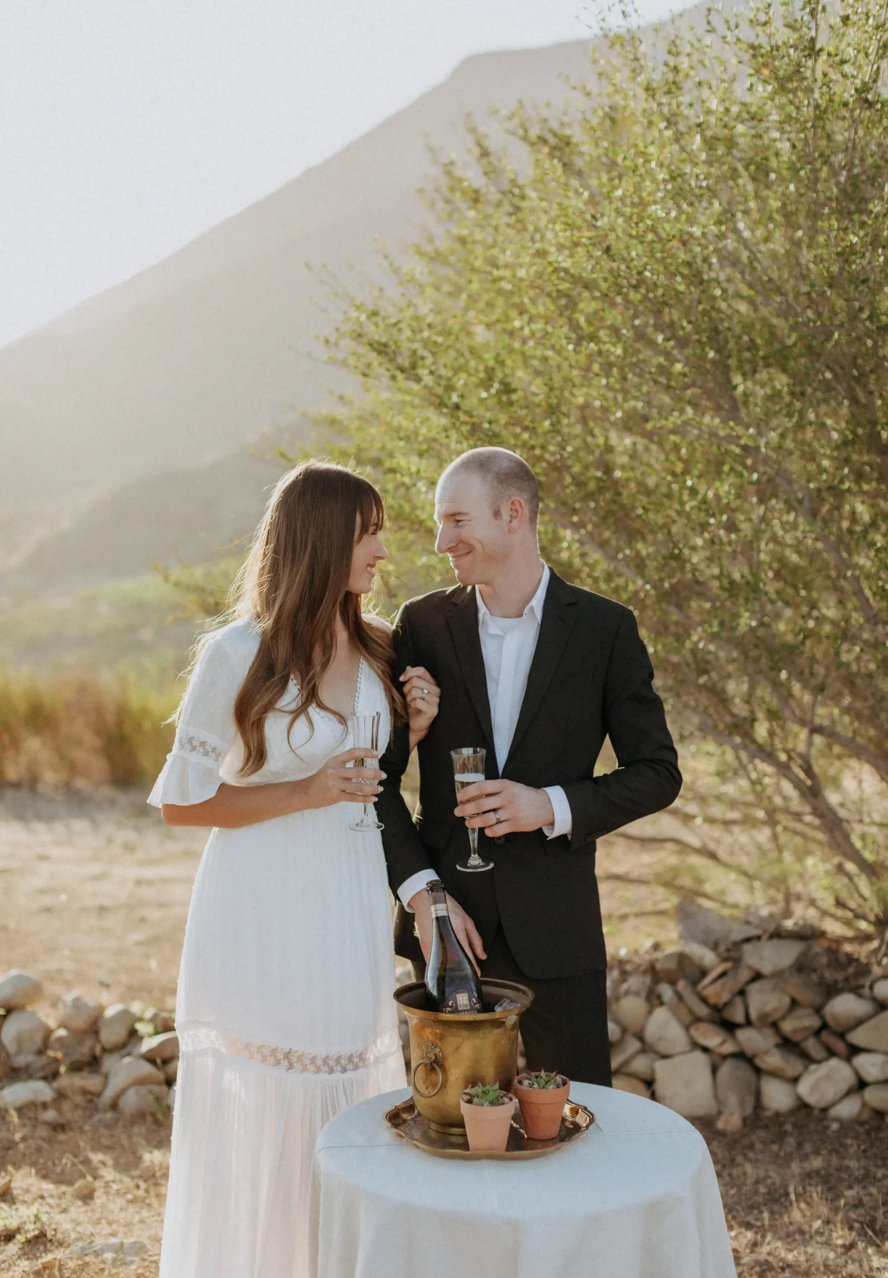 happily newly married couple with champagne