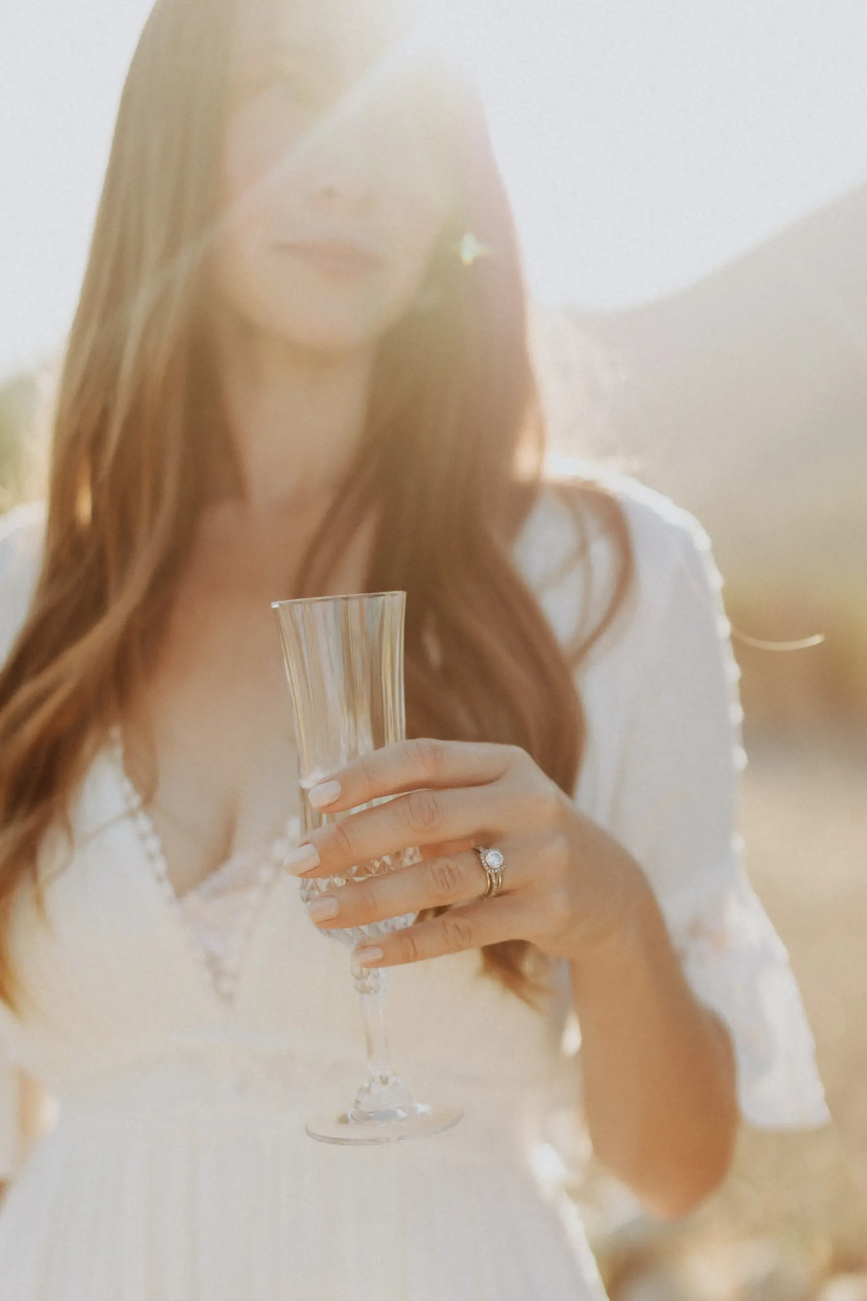 bride holding champagne flute